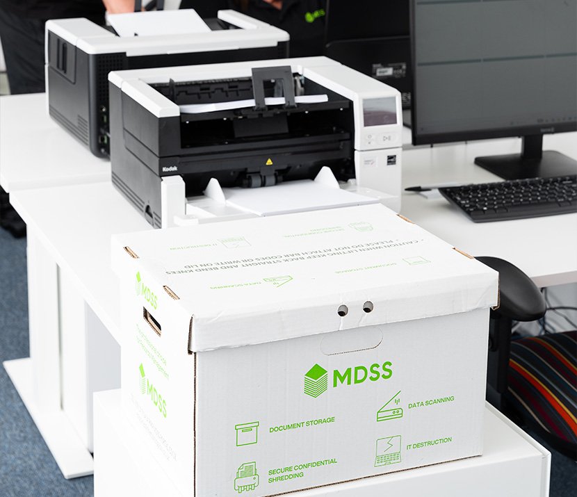 Document box beside a digital scanner