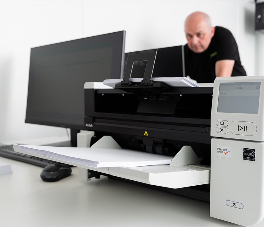 Operator using aperture card scanning equipment