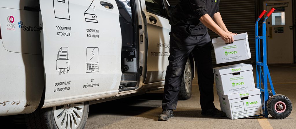 Document storage boxes being loaded into an MDSS vehicle